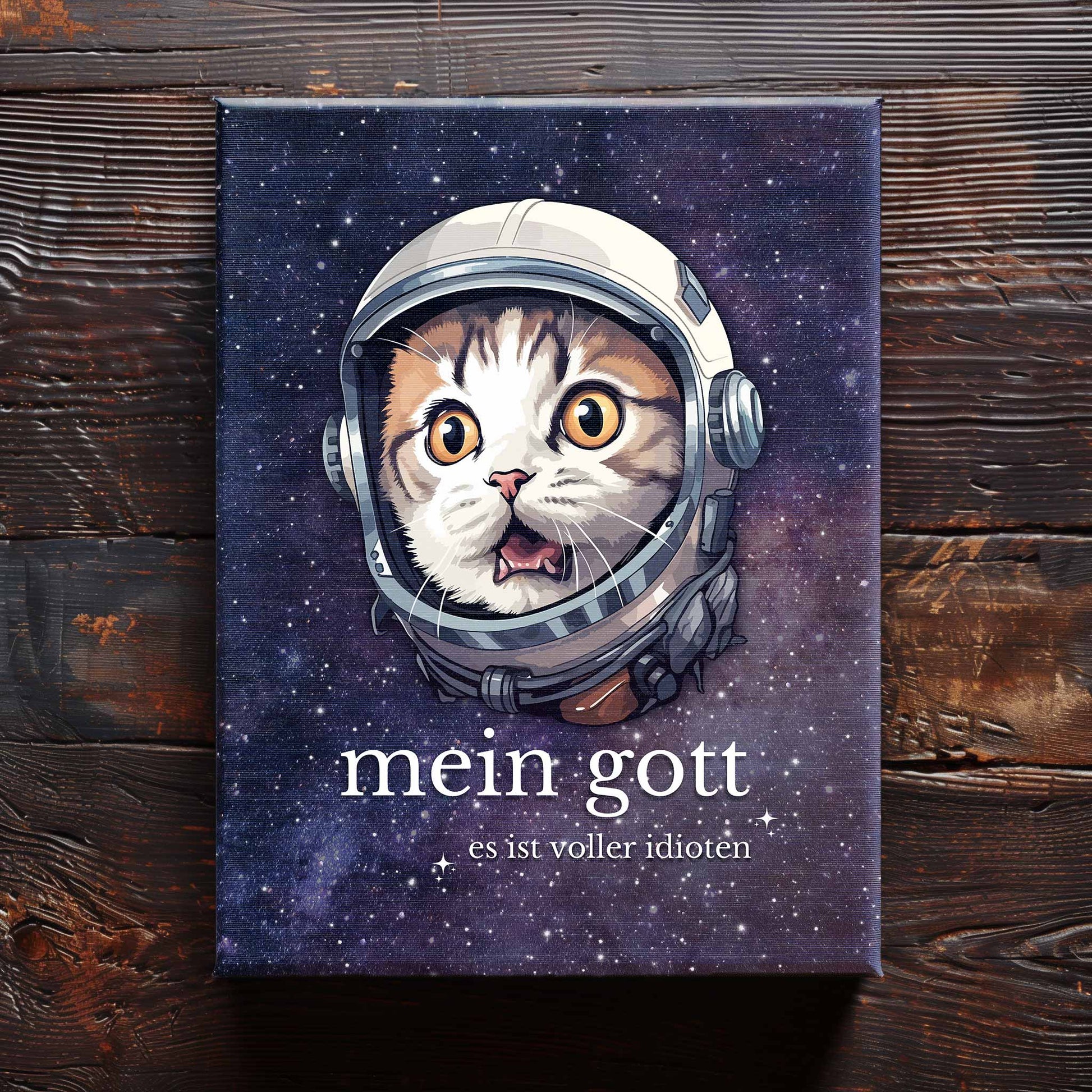 90x120 cm große Leinwand auf Holzboden mit Design einer Katze im Astronauten-Anzug und dem lustigen Spruch 'Mein Gott - Es ist voller Idioten'